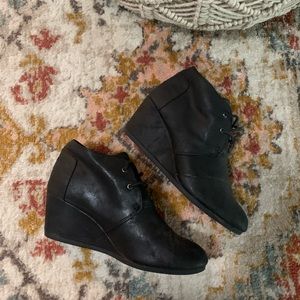 Tom’s Black Metallic Wedge Booties